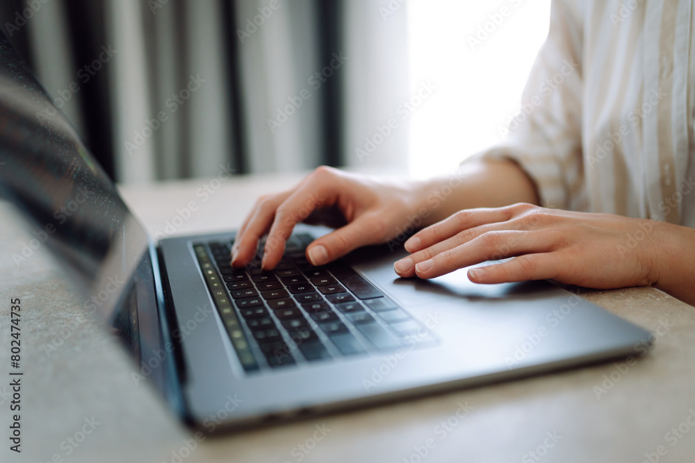 Close-up of a woman typing on a laptop keyboard. Business, Freelance, Shopping, education. Online. Close-up of a woman typing on a laptop keyboard. Business, Freelance, Shopping, education. Online.