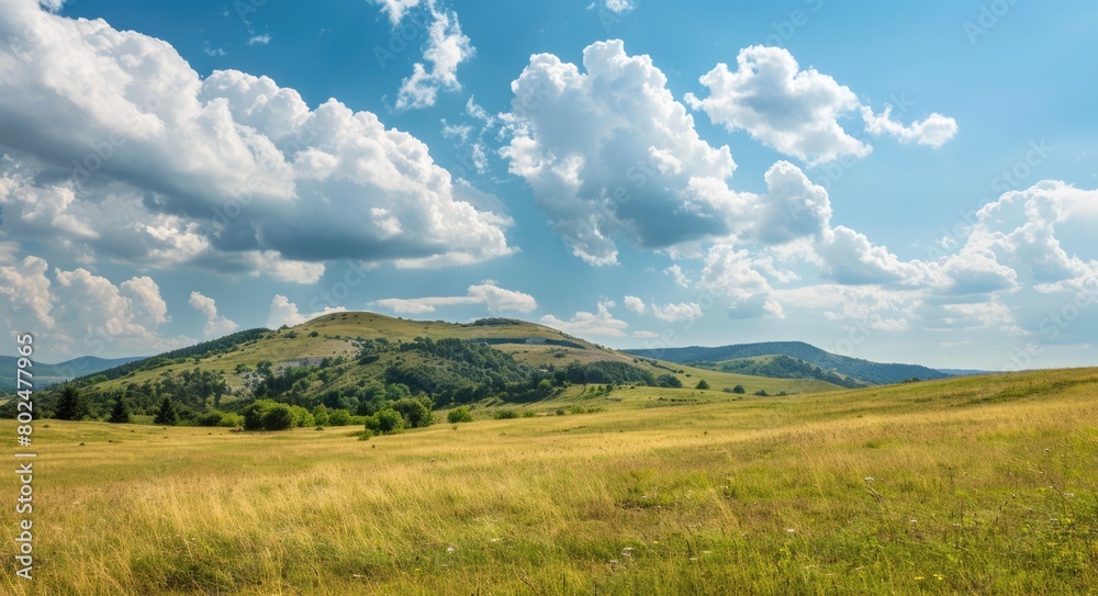 Landscape: Serene Mountain View & Rolling Green Hills with Azure Sky & Fluffy Clouds