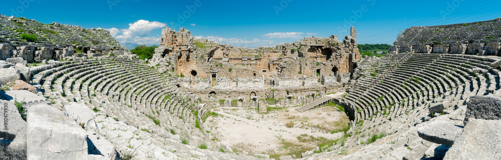 Picturesque ruins of an amphitheater in the ancient city of Perge, Turkey. Perge open-air museum.