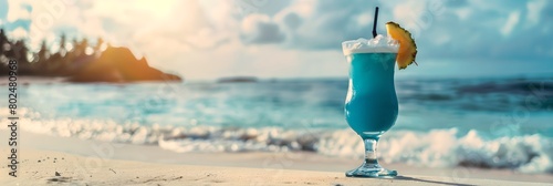 Blue lagoon cocktail on the beach background. Tropical drink for summer party. Refreshing beverage concept. Banner with copy space