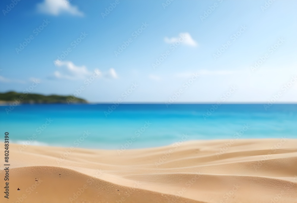 Sandy beach with turquoise ocean and blue sky in the background