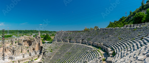 Picturesque ruins of an amphitheater in the ancient city of Perge, Turkey. Perge open-air museum. photo