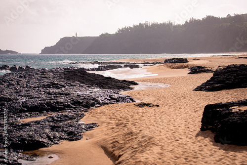 Kauapea (Secret) Beach, Kauai, Hawaii. Secluded beach with a cliff accessible by a pretty steep trail photo