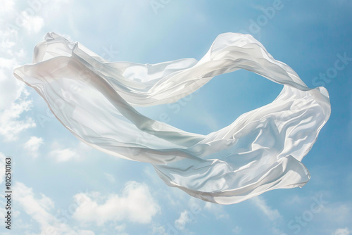 A plain white scarf floating in the wind.