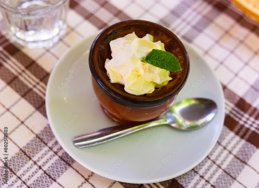 Image of Flan with cream con nata, beautiful restaurant presentation of dish
