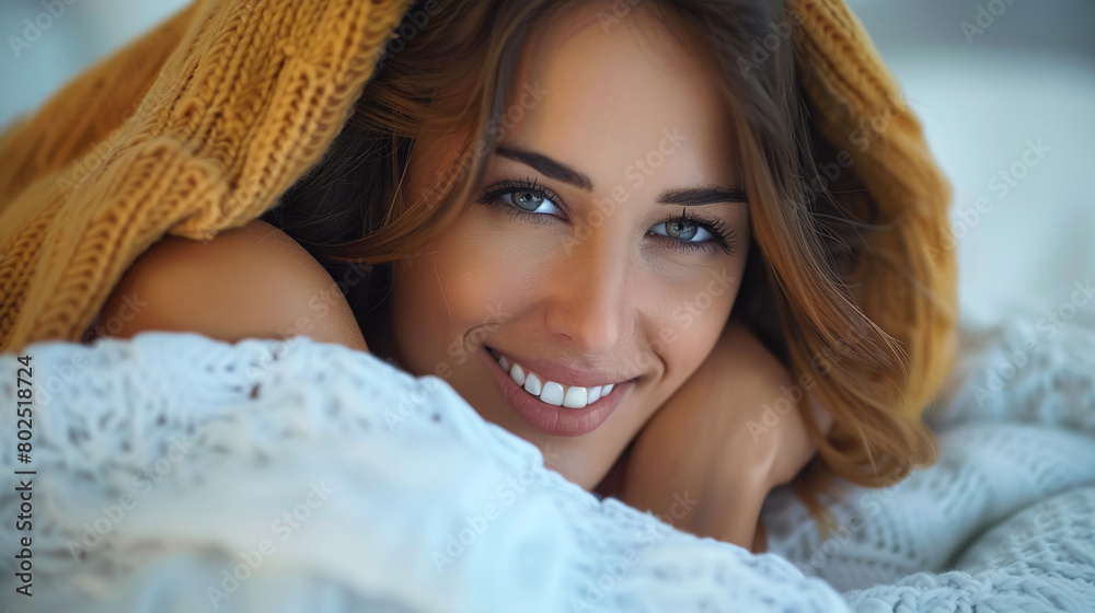 close up beauty portrait of a woman with blankets