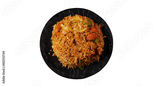 Fried rice with chicken and vegetables on black plate isolated on white background