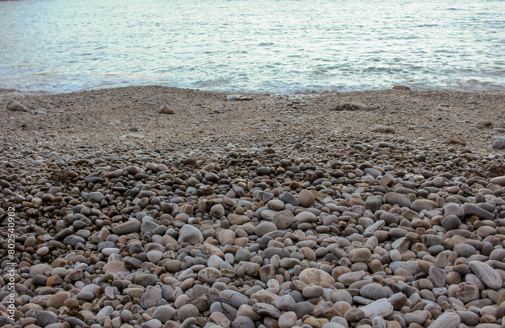 small, round rocks in the beach of Silence small, round rocks in the beach of Silence