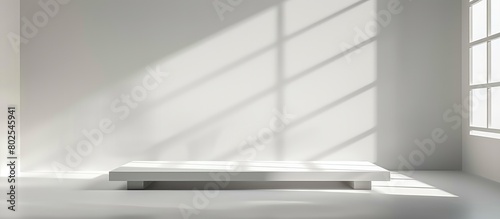Empty gray studio environment with abstract white design, ideal for showcasing cosmetic products. Background features window shadows, allowing product display against a blurred backdrop.