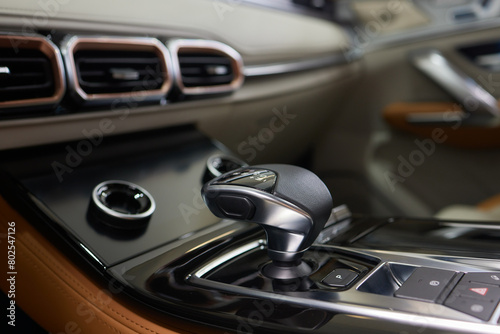 a close up of a car dashboard with a remote control © Евгений Вершинин