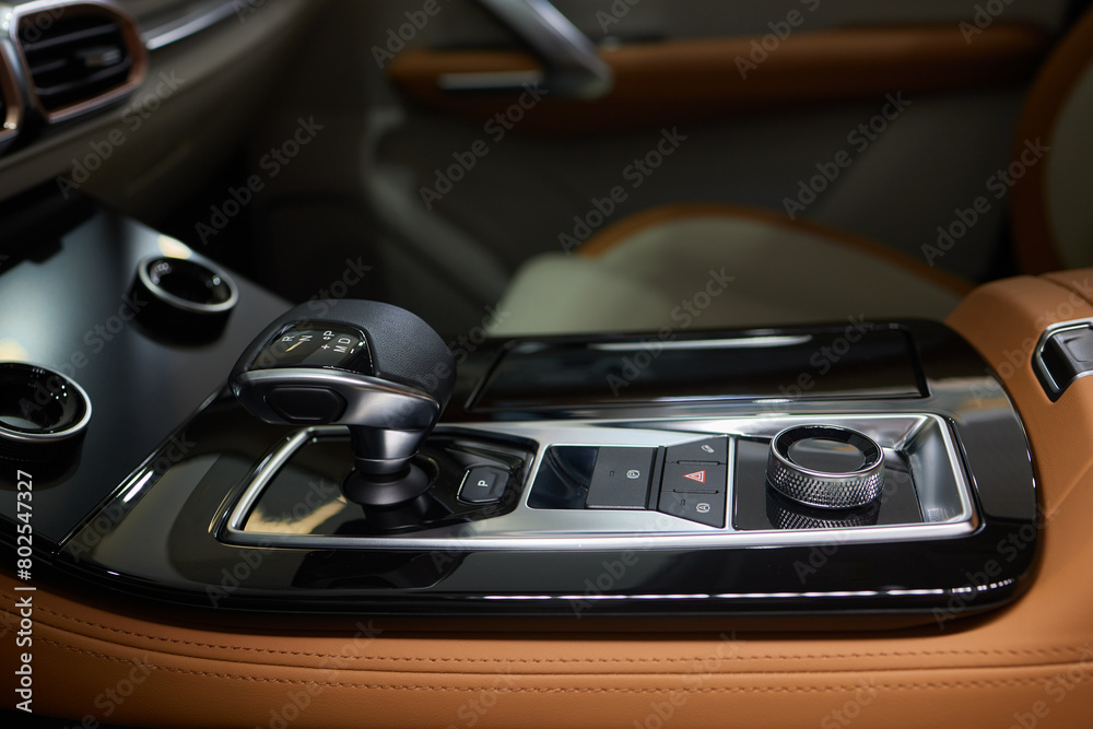 a close up of a car dashboard with a remote control