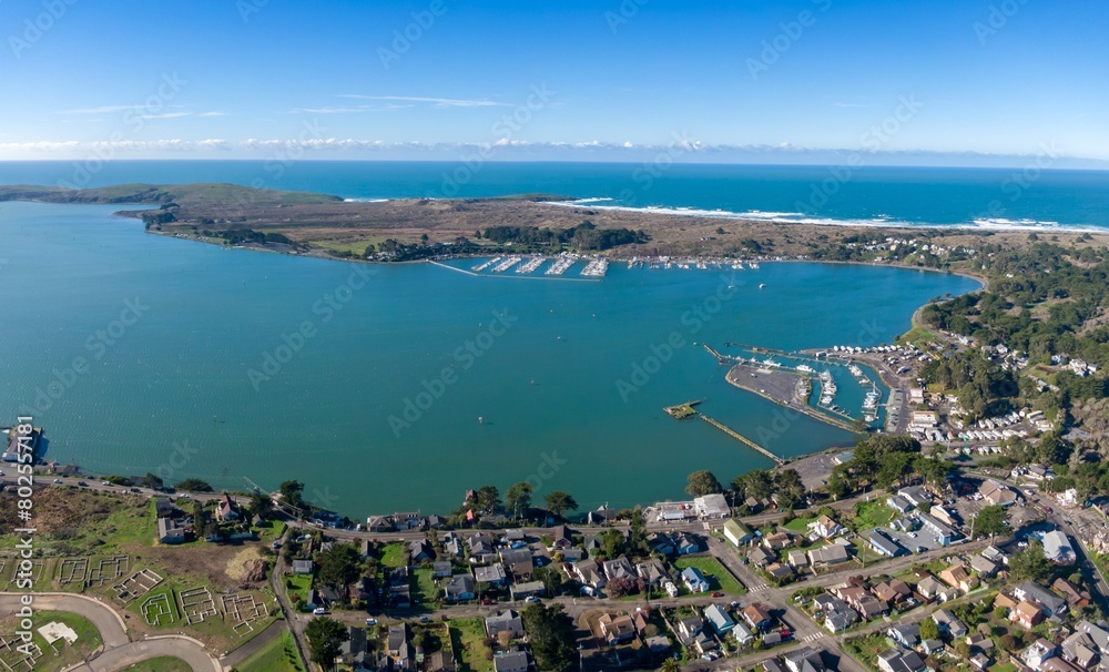 Fototapeta premium Aerial of ocean, township and marina in Bodega Bay, California, United States of America.
