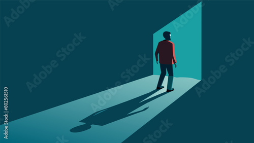 A shadow receding and allowing the person to step into the light..