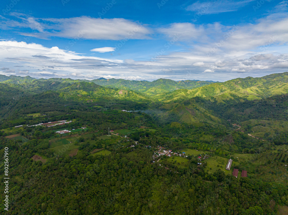 Mountain landscape: Mountain slopes covered with rainforest and jungle. Mindanao, Philippines.
