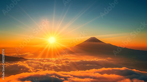 a breathtaking sunrise over a sea of clouds  with the sun casting its golden rays across the sky and illuminating the silhouette of a mountain peak