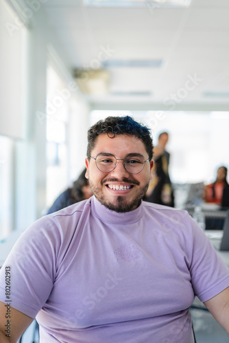 Portrait of a lgbtq man looking at the camera in the classroom