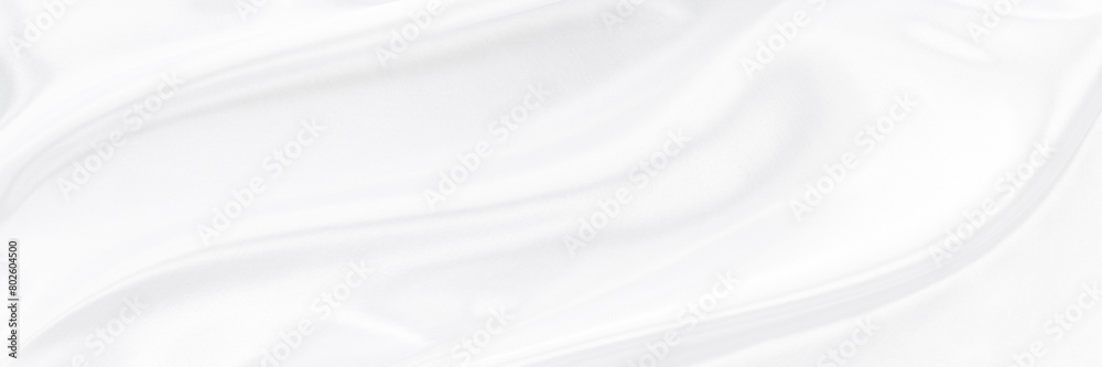 White gray satin texture that is white silver fabric silk panorama background with beautiful soft blur pattern natural.