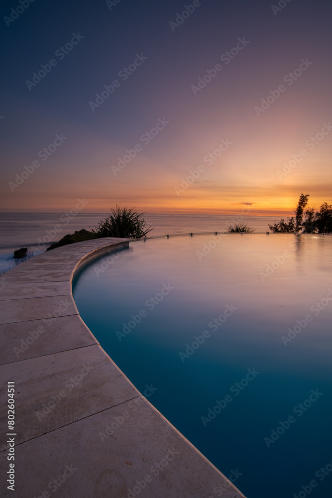 Sunset view from infinity pool beach lounge at Gunung Kidul Yogyakarta Indonesia