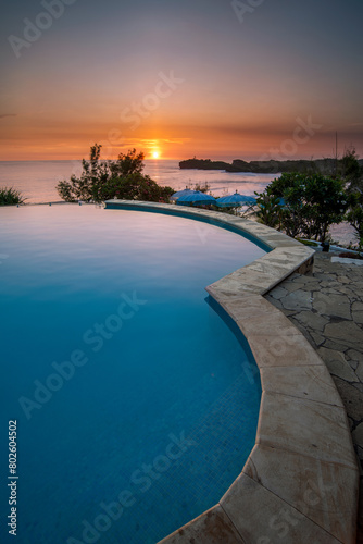 Sunset view from infinity pool beach lounge at Gunung Kidul Yogyakarta Indonesia © Martanto Setyo H