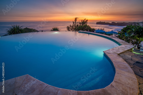 Sunset view from infinity pool beach lounge at Gunung Kidul Yogyakarta Indonesia