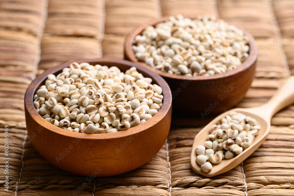 Dried Job's tears or adlay millet in wooden bowl Dried Job's tears or adlay millet in wooden bowl
