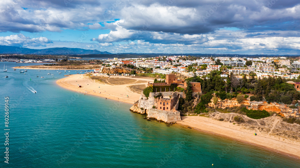 Ferragudo with the Praia Grande (the main beach) and the river Rio Arade, Algarve, Portugal. Beautiful seascape with beach, cave and ocean, Praia Grande beach, Ferragudo, Lagoa, Algarve, Portugal. Ferragudo with the Praia Grande (the main beach) and the river Rio Arade, Algarve, Portugal. Beautiful seascape with beach, cave and ocean, Praia Grande beach, Ferragudo, Lagoa, Algarve, Portugal.
