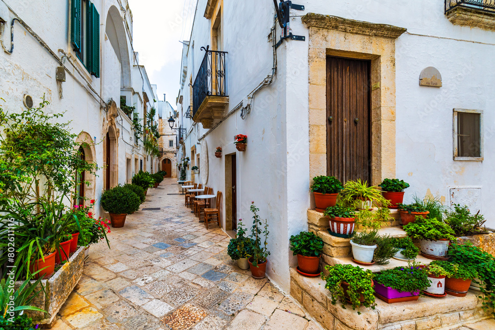 Scenic sight in Locorotondo, Bari Province, Apulia (Puglia), Italy. Characteristic streets in the Locorotondo in Puglia, Italy. Locorotondo is a town of the Metropolitan City of Bari, Apulia, Italy.