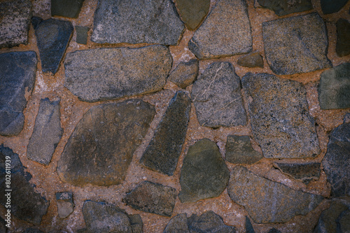 Granite stones of different shapes and colors. Wall cladding. 1