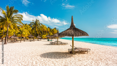 Le morne Brabant beach in Mauriutius. Tropical crystal ocean with Le Morne beach and luxury beach in Mauritius. Le Morne beach with palm trees, white sand and luxury resorts, Mauritius.
