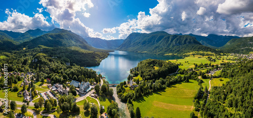 Aerial view of Bohinj lake in Julian Alps. Popular touristic destination in Slovenia. Bohinj Lake, Church of St John the Baptist. Triglav National Park, Julian Alps, Slovenia. photo