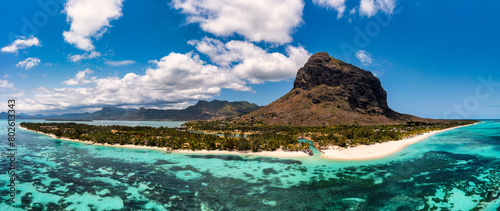 Aerial view of Le morne Brabant in Mauriutius. Tropical crystal ocean with Le Morne mountain and luxury beach in Mauritius. Le Morne beach with palm trees, white sand and luxury resorts, Mauritius. photo