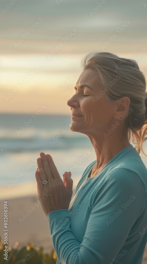 Serene Dawn Yoga: Mature Hispanic Woman Embracing Menopause with Morning Beach Meditation