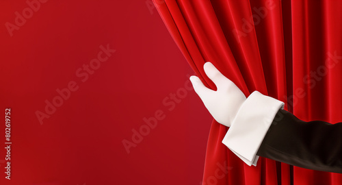 Theater & Performing Arts. A hand in a white glove elegantly opens a red curtain, symbolizing a grand opening, new beginnings, or a theatrical performance. copy space