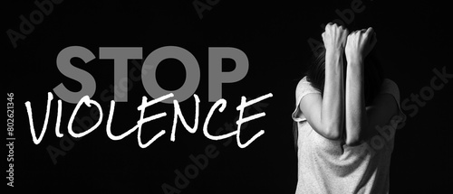 Scared young woman on dark ...