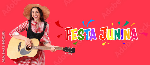 Young woman playing guitar ...