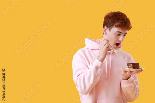 Young man eating birthday c...