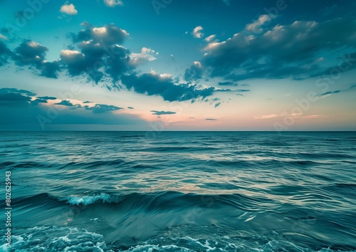 Tranquil Sea at Twilight with Blue Skies and Fluffy Clouds