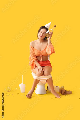 Drunk young Asian woman wit...