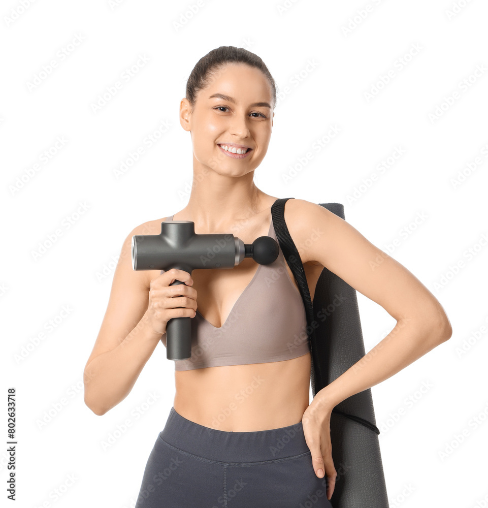 Sporty young woman with percussive massager and fitness mat on white background Sporty young woman with percussive massager and fitness mat on white background