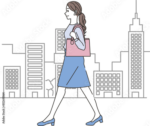 オフィスカジュアルコーデの歩く女性