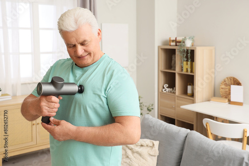 Mature man massaging his ch...
