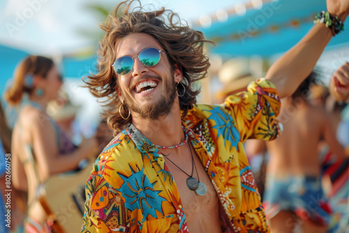  A young man at a music festival, dressed in bohemian-inspired fashion with a graphic tee and patterned shorts, dancing and having a great time.
