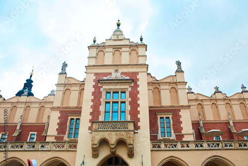 Ancient European architecture. The beautiful facade of the church building on the Market Square in the center of Krakow.