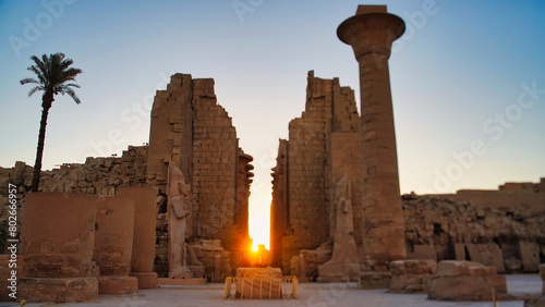 Morning sunlight fills the central passage of the Great Temple of Karnak with soft focus views of the entrance pylons at the Karnak temple complex dedicated to Amun-Re in Luxor,Egypt