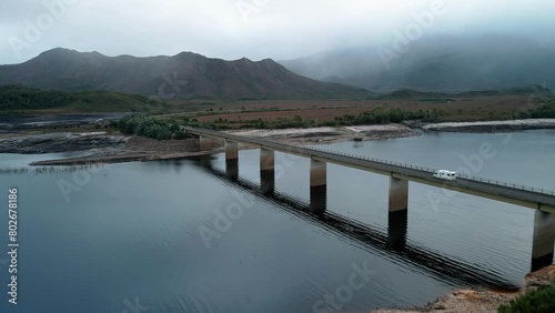 Wallpaper Mural Forward aerial view of Lake Burbury with vehicles passing through bridge in Tasmania , Australia on a foggy day. Torontodigital.ca