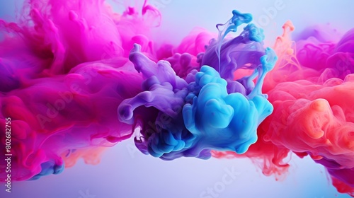 Stunning visual of colorful ink clouds merging in water, creating a fluid and ethereal abstract pattern.