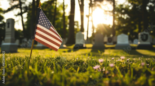 American flag in cemetery during sunset