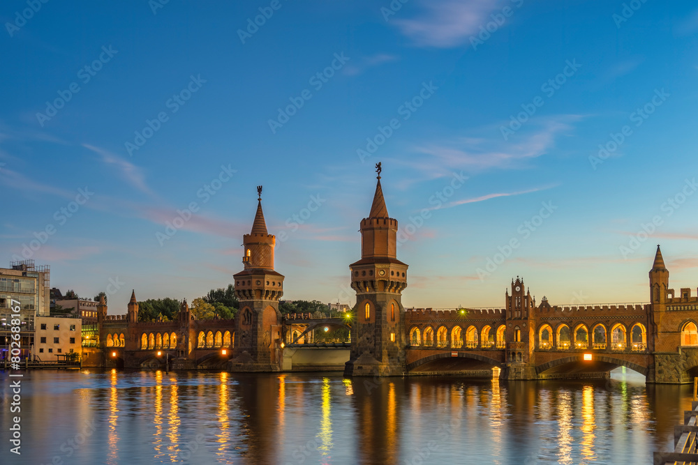 Berlin Germany, sunset city skyline at Oberbaum Bridge and Spree River