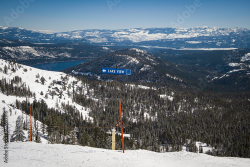 Photo of the Lake View intermediate run sign near Mt. Lincoln Express chairlift at Sugar Bowl Resort, with Donner Lake in the background.