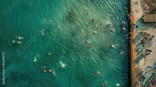 Aerial Drone View of People Swimming in Cold Water in the Winter, Epiphany Christian Holiday, Varna, Bulgaria.